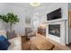 Relaxing sitting area with a fireplace and wet bar at 7944 Dante Dr, Littleton, CO 80125