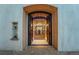View into a brick wine cellar with stone fountain at 7944 Dante Dr, Littleton, CO 80125