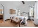 Spacious bedroom with a comfortable bed and access to a private bathroom at 7944 Dante Dr, Littleton, CO 80125