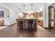 Basement bar with large island and herringbone floors at 7944 Dante Dr, Littleton, CO 80125