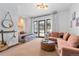 Charming bedroom with a comfy couch and access to a patio at 7944 Dante Dr, Littleton, CO 80125