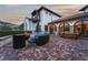 Brick patio with seating area and fire pit, overlooking scenic views at 7944 Dante Dr, Littleton, CO 80125