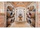 Wine cellar with wooden barrels and stone fountain at 7944 Dante Dr, Littleton, CO 80125