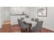 Modern dining area with hardwood floors and a glass top table at 2855 Rock Creek Cir # 191, Superior, CO 80027