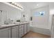 Double vanity bathroom with granite countertop and a bathtub at 2855 Rock Creek Cir # 191, Superior, CO 80027