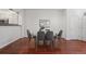 Dining area with hardwood floors and modern gray chairs at 2855 Rock Creek Cir # 191, Superior, CO 80027