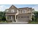 Two-story craftsman style home with large windows and attached garage at 196 Kino Ct, Brighton, CO 80601