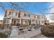 Townhome exterior with stone and siding, covered entry, and walkway at 845 E 98Th Ave # 2004, Thornton, CO 80229