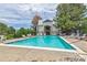 Inviting community pool with surrounding lounge chairs at 17473 E Mansfield Ave # 111Wl, Aurora, CO 80013