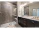 Bathroom boasts double vanity, large shower and modern fixtures at 9390 Accord Ln # 305, Parker, CO 80134