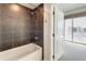 Bathroom with shower and view into bedroom at 2001 Lincoln St # 1024, Denver, CO 80202