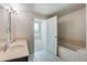 Bathroom with double vanity, bathtub, and separate shower at 2001 Lincoln St # 1024, Denver, CO 80202