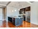 Modern kitchen with stainless steel appliances and large island at 2001 Lincoln St # 1024, Denver, CO 80202