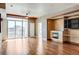 Hardwood floor living room, fireplace, and city views at 2001 Lincoln St # 1024, Denver, CO 80202