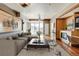 Spacious living room with hardwood floors, fireplace, and city views at 2001 Lincoln St # 1024, Denver, CO 80202
