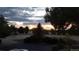 Property boasts a picturesque sunset view over a park-like area at 6803 S Liverpool St, Centennial, CO 80016