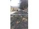 Property features a spacious front yard with mature trees and a well-maintained lawn at 6803 S Liverpool St, Centennial, CO 80016