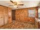 Bright bedroom with large closet and wood paneling at 3250 E 84Th Dr, Thornton, CO 80229