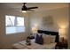 Charming bedroom with a bed, nightstands, and window at 7935 Chase Cir # 170, Arvada, CO 80003