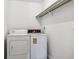 Laundry room with washer, dryer, and storage at 6960 E Girard Ave # 409, Denver, CO 80224