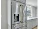 Stainless steel refrigerator with gold handles at 8834 E Radcliff Ave, Denver, CO 80237