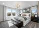 Main bedroom with king bed, large windows, and mountain views at 16501 W 93Rd Ave, Arvada, CO 80007