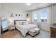 Main bedroom with large windows, plush carpet, and ample natural light at 10334 Milwaukee Cir, Denver, CO 80229