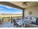 Covered patio features comfortable seating and views of the surrounding area at 4171 Happy Hollow Dr, Castle Rock, CO 80104