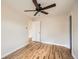 Bedroom featuring hardwood floors, a ceiling fan, and neutral-toned walls, creating a relaxing atmosphere at 420 Utica St, Denver, CO 80204