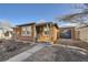 Inviting front yard and attached garage at 420 Utica St, Denver, CO 80204