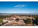 Aerial view of a country club with a golf course and mountain views at 6192 Oxford Peak Ln, Castle Rock, CO 80108