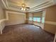 Spacious main bedroom with carpeted floors and bay windows at 22840 E Heritage Pkwy, Aurora, CO 80016