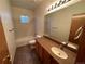 Clean bathroom, featuring a tub, toilet and updated vanity at 22840 E Heritage Pkwy, Aurora, CO 80016
