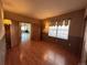 Spacious bedroom with hardwood floors and views into another room at 22840 E Heritage Pkwy, Aurora, CO 80016