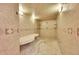 Large, tiled basement shower with bench seating at 14955 W 58Th Pl, Golden, CO 80403