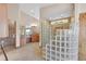 Luxurious bathroom with a large glass block shower and granite vanity at 14955 W 58Th Pl, Golden, CO 80403