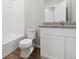 Clean bathroom with white cabinets and granite countertop at 2400 Christina St, Fort Lupton, CO 80621