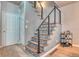 Modern staircase with metal railing and tile accents at 8016 E Fairmount Dr, Denver, CO 80230