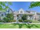 Two-story townhome with brick facade at 8016 E Fairmount Dr, Denver, CO 80230