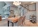 Bright dining room with hardwood floors and modern light fixture at 8016 E Fairmount Dr, Denver, CO 80230