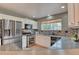 Modern kitchen with stainless steel appliances and granite countertops at 8016 E Fairmount Dr, Denver, CO 80230