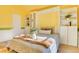 Cozy bedroom with built-in shelves and a comfortable bed at 8016 E Fairmount Dr, Denver, CO 80230