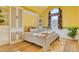 Charming bedroom with a murphy bed and large window at 8016 E Fairmount Dr, Denver, CO 80230
