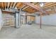 Unfinished basement with high ceilings and plenty of storage at 8016 E Fairmount Dr, Denver, CO 80230