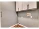 Convenient laundry room with upper cabinets at 8016 E Fairmount Dr, Denver, CO 80230