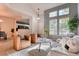 Open living room with a view into the kitchen and access to backyard at 8016 E Fairmount Dr, Denver, CO 80230
