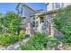 Inviting exterior with well-maintained landscaping and walkway at 8016 E Fairmount Dr, Denver, CO 80230