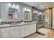 Elegant bathroom with double vanity, large shower, and modern fixtures at 8016 E Fairmount Dr, Denver, CO 80230