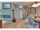 Bright and airy entryway with a fireplace and staircase at 8016 E Fairmount Dr, Denver, CO 80230