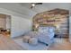 Main bedroom with wood-look accent wall, high ceilings and soft color tones at 8016 E Fairmount Dr, Denver, CO 80230